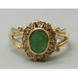 A 9ct gold, emerald and diamond cluster ring, 3.4g, M
