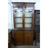 An Edward VII inlaid mahogany bookcase