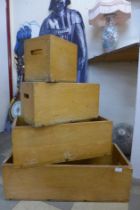 A set of four graduated oak boxes
