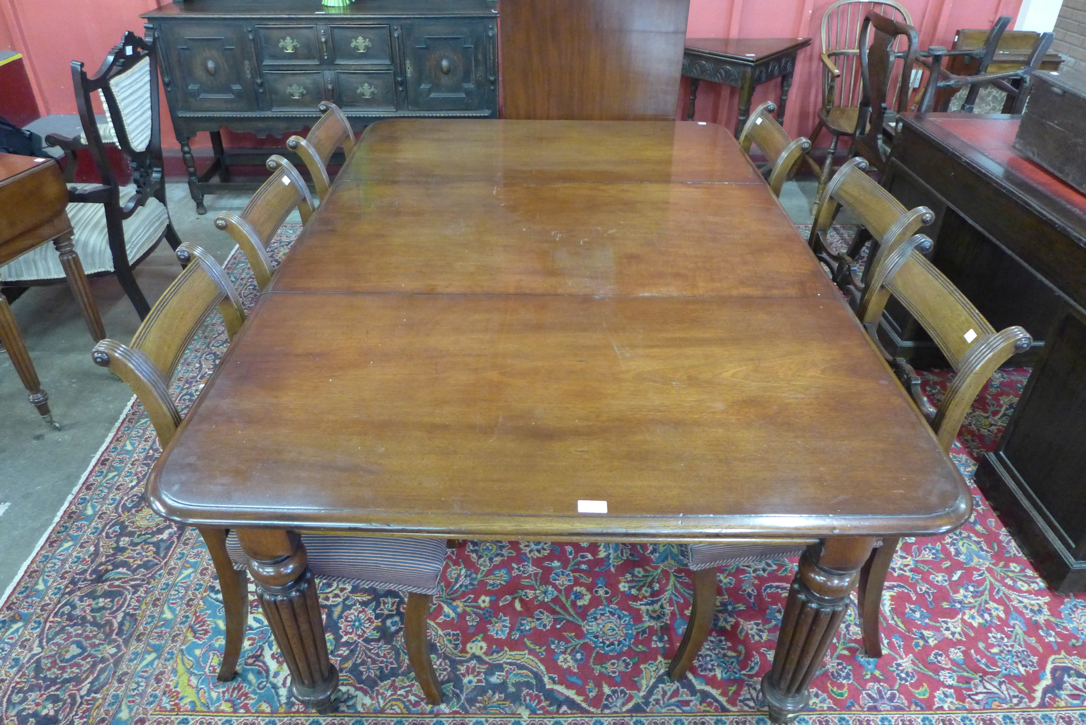A Victorian mahogany extending dining table and six Regency style chairs, table dimensions; 72cms h, - Image 2 of 5