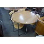 A circular chrome and beech kitchen table and four chairs