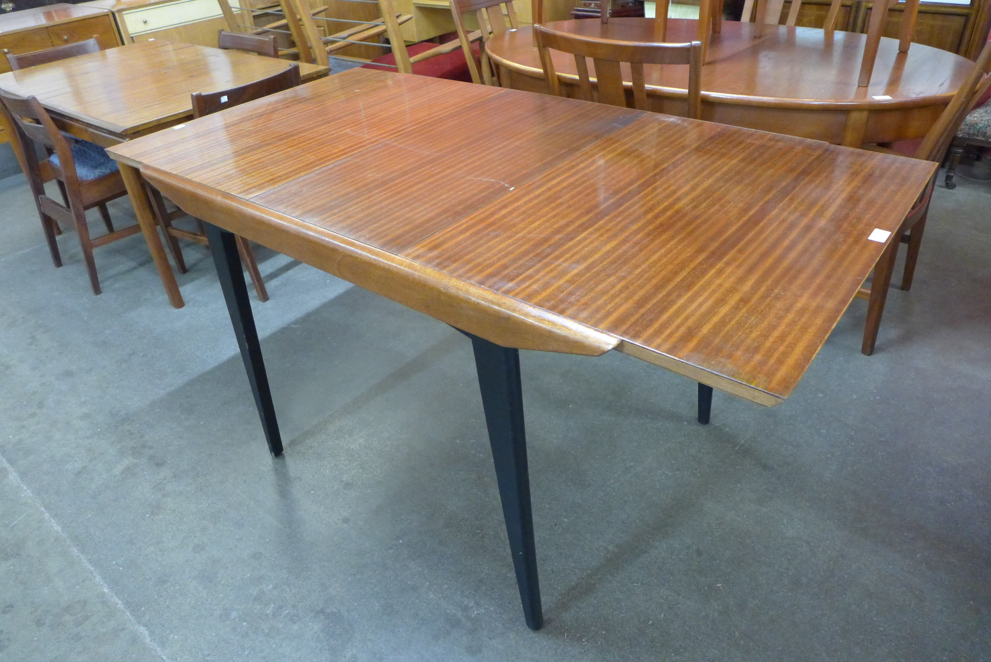 A tola wood and black extending dining table - Image 2 of 2