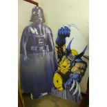 Four assorted cardboard movie cut-outs