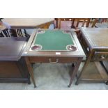 An Edward VII inlaid mahogany single drawer games table