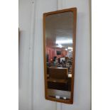 A teak framed mirror