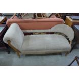 An Edward VII carved walnut and upholstered chaise longue