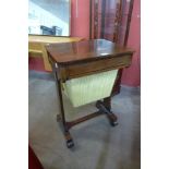 A Victorian rosewood sewing table