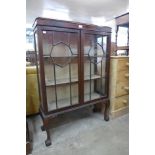 A mahogany ball and claw two door display cabinet
