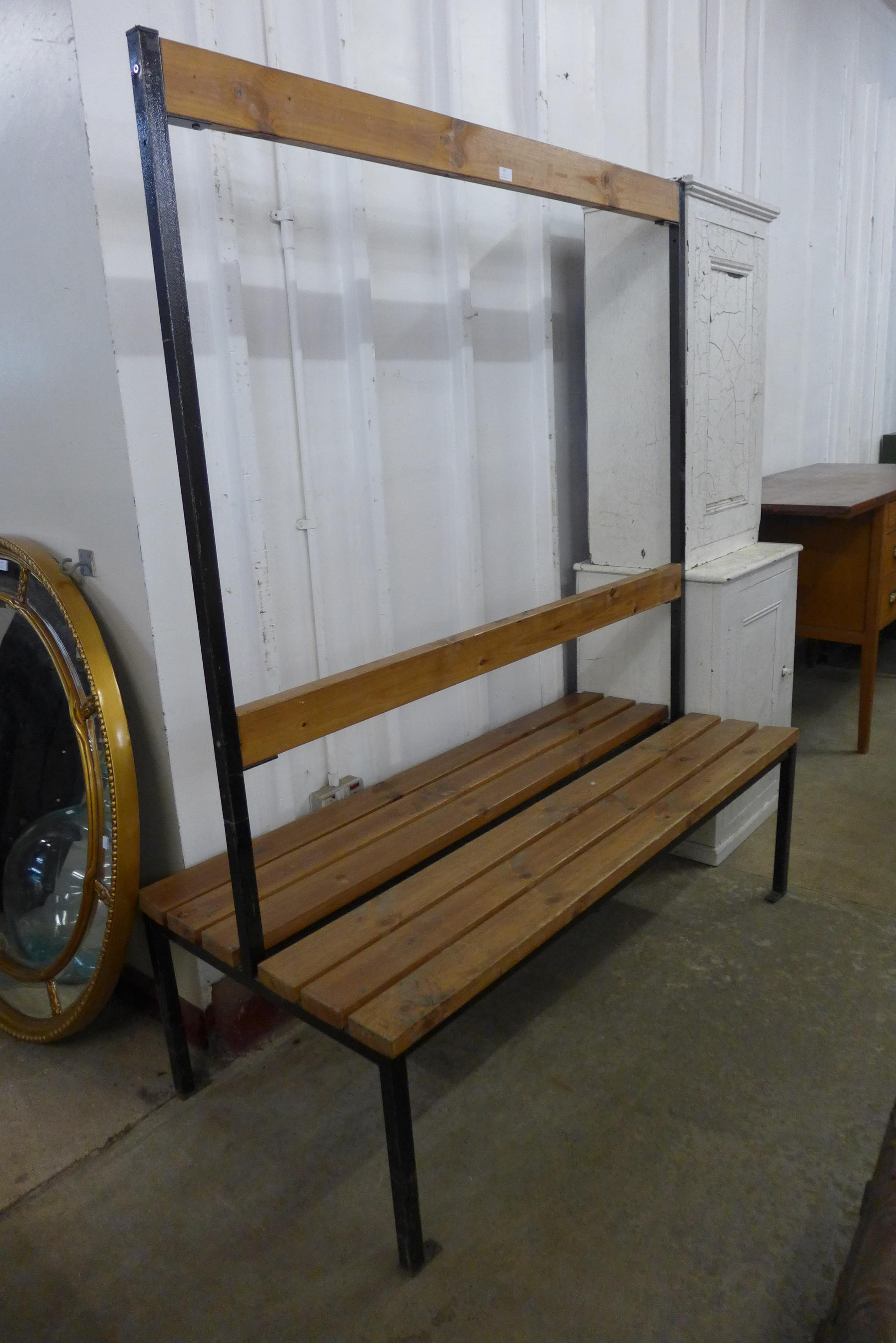 A vintage pine and steel double bench