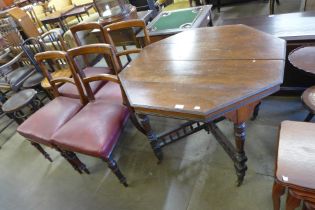 A Victorian mahogany octagonal centre table and four dining chairs