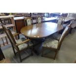 An Old Charm oak extending dining table and six chairs