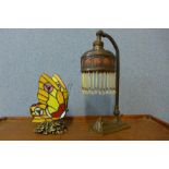 An Art Nouveau table lamp and a Tiffany style butterfly shaped table lamp