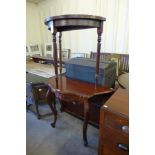 A mahogany demi lune table and another hall table