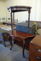 A mahogany demi lune table and another hall table