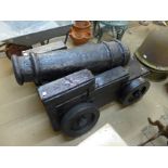 A painted wooden and plaster of Paris cannon