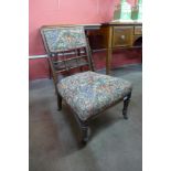 An Arts and Crafts mahogany fire side chair