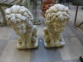 A pair of concrete figural painted garden lions