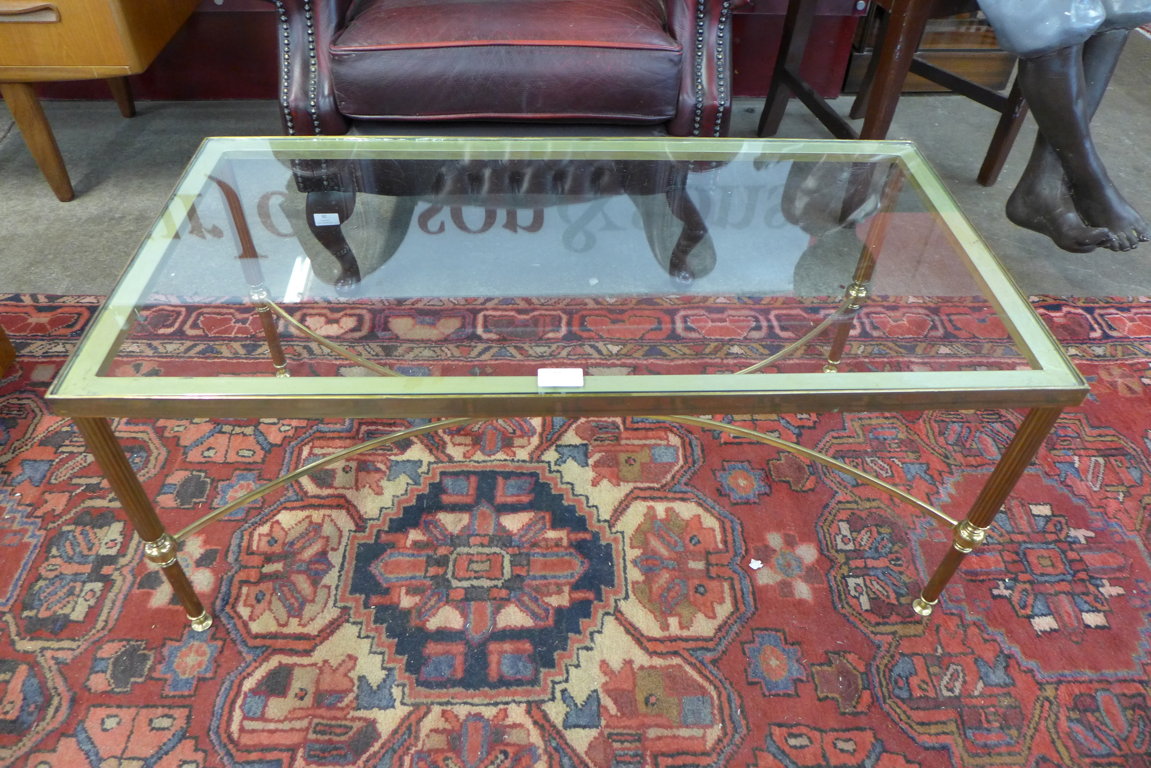 An Italian brass and glass topped coffee table