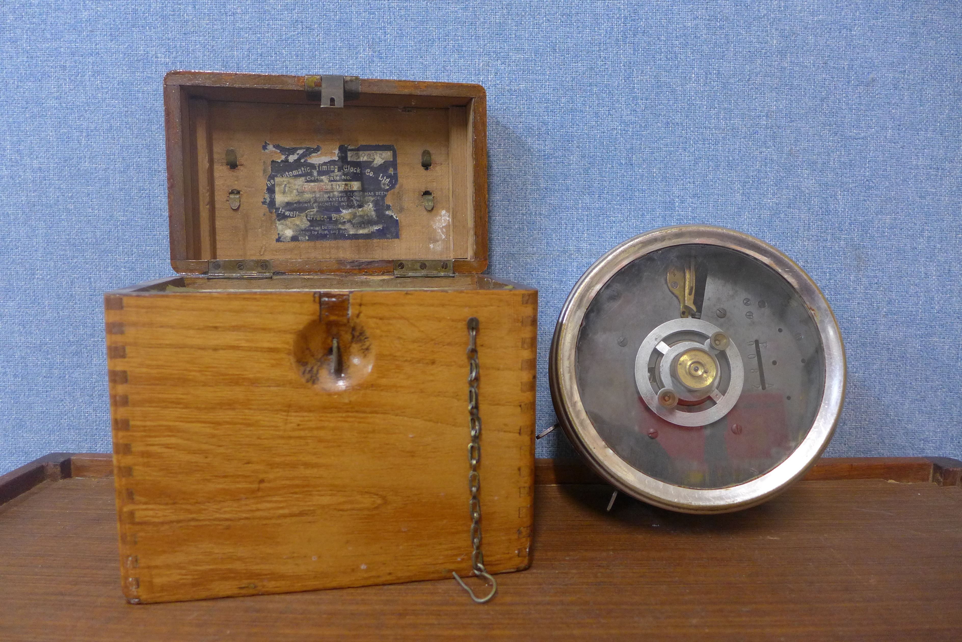 A vintage cased pigeon racing clock