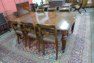 A Victorian mahogany extending dining table and six Regency style chairs, table dimensions; 72cms h,