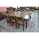 A Victorian mahogany extending dining table and six Regency style chairs, table dimensions; 72cms h,