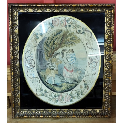 A Regency oval silkwork, depicting a young couple with baby, within a border of flowers and swags, - Image 2 of 2