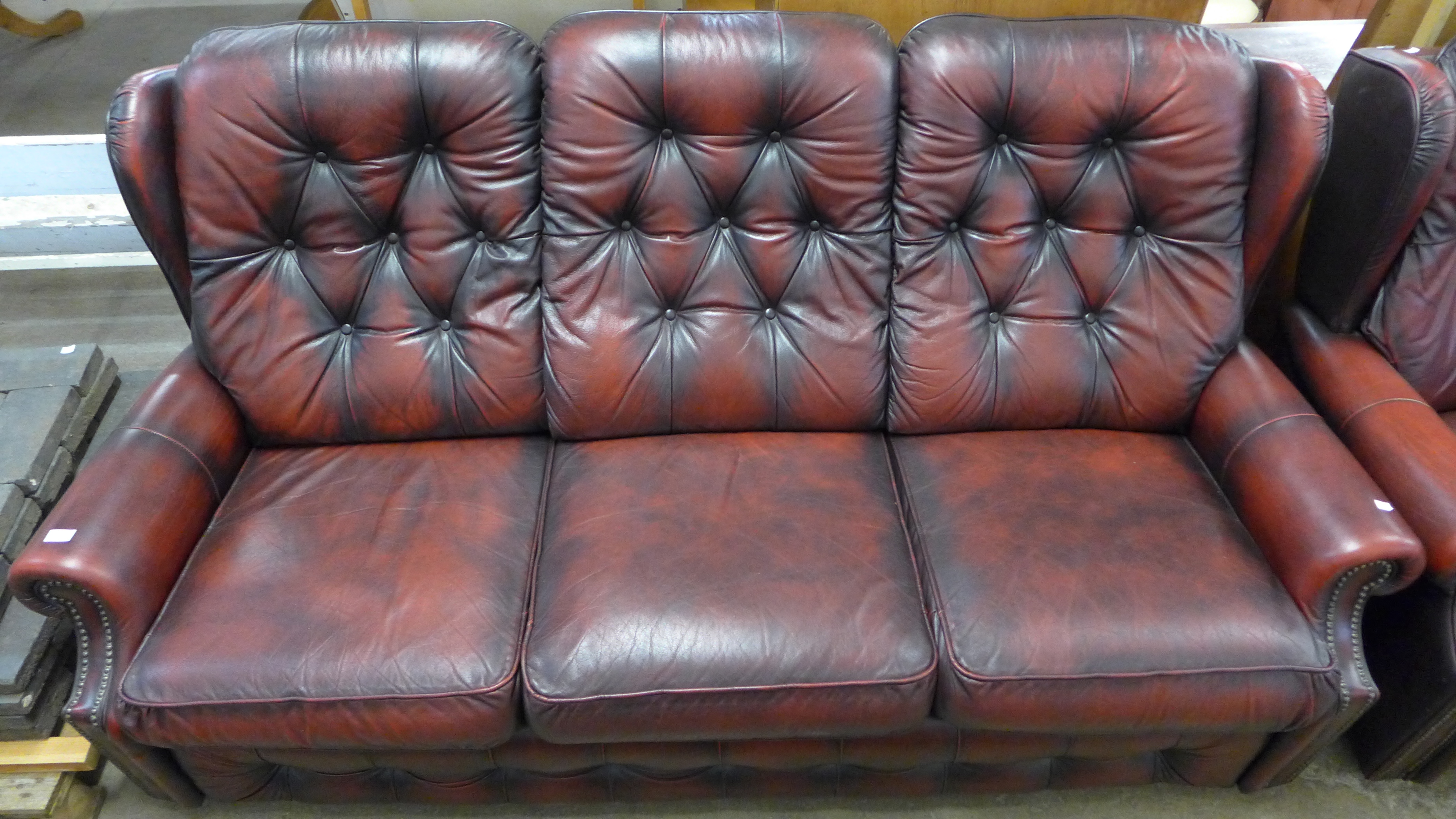 A red leather buttoned sofa and armchair - Image 2 of 3