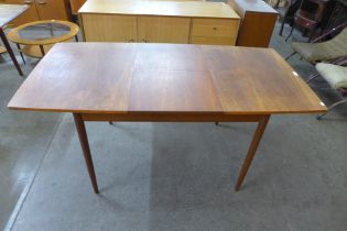 A Greaves and Thomas teak extending dining table