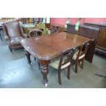 A Victorian mahogany extending dining table and four chairs