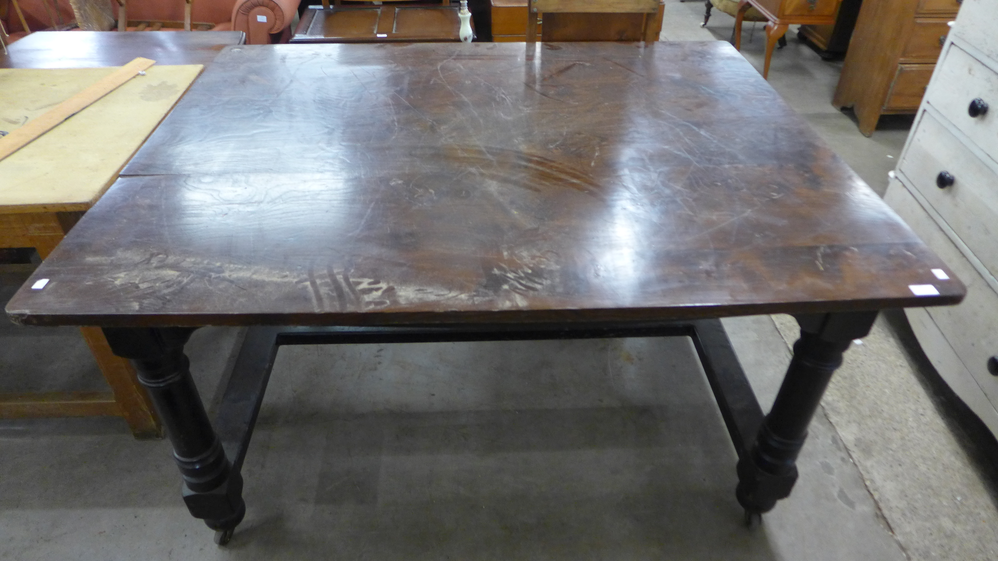 A Victorian painted beech kitchen table with an elm top
