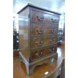 A small mahogany chest of drawers