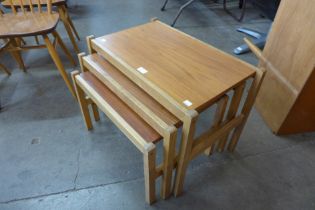 A teak and beech nest of tables