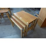 A teak and beech nest of tables