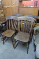A harlequin set of four beech and elm seated kitchen chairs