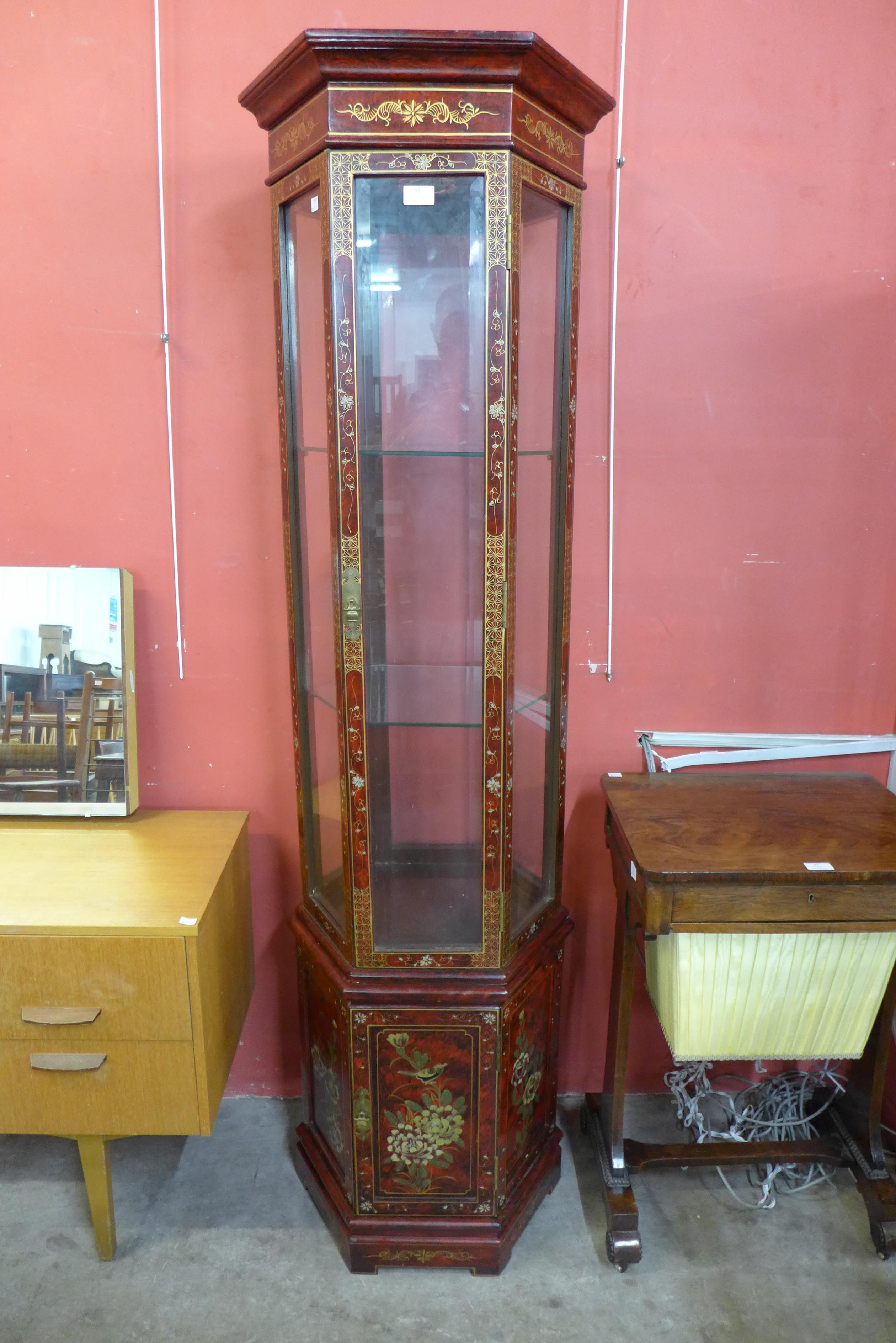 A Japanned hexagonal display cabinet