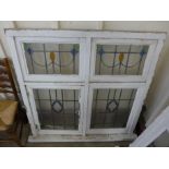 An Arts and Crafts stained glass four panel window