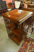 An Edward VII style inlaid mahogany revolving bookcase