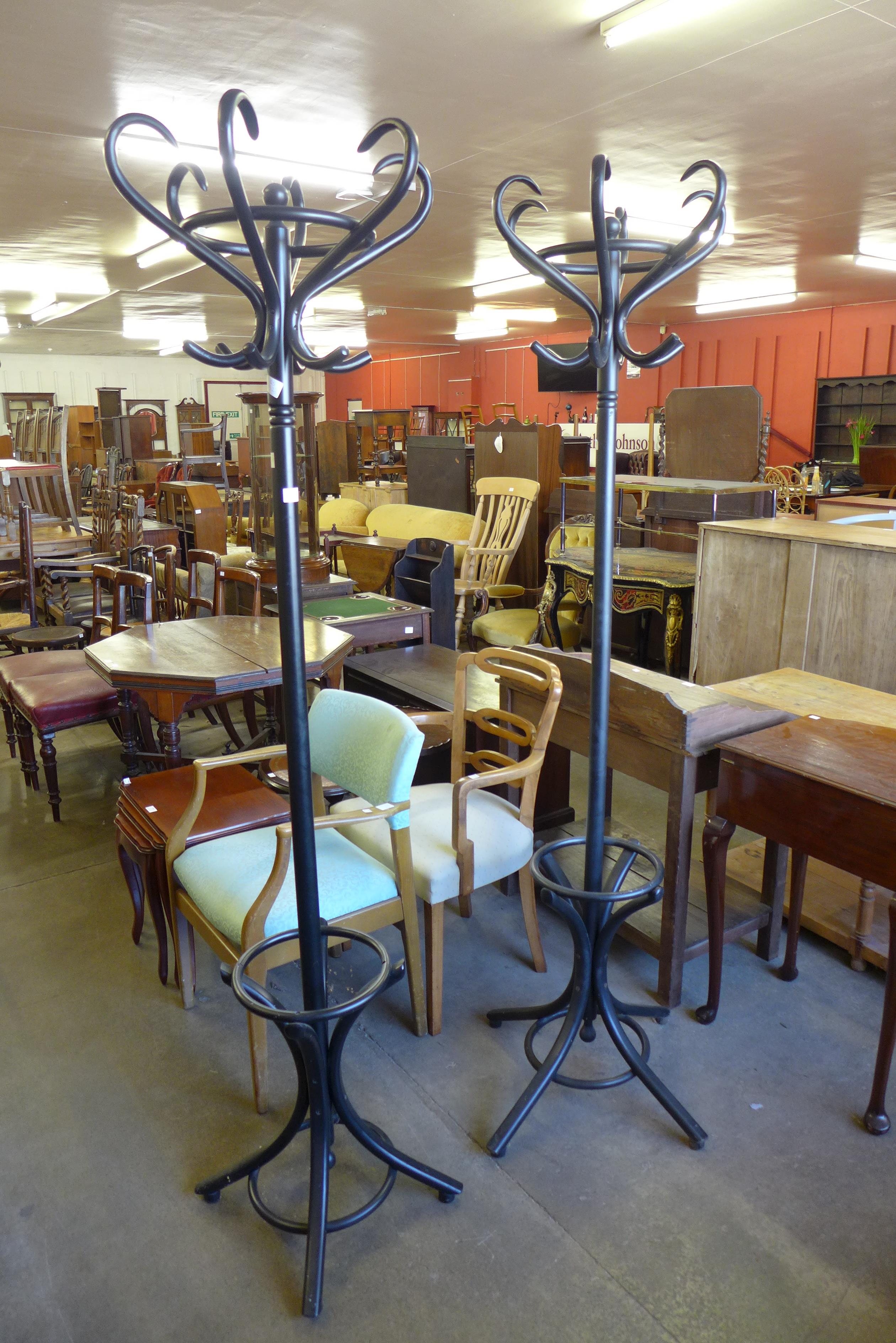 A pair of ebonised bentwood coatstands