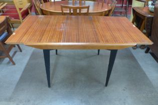 A tola wood and black extending dining table