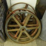 Four vintage cast iron wheels