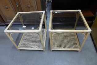 A pair of bamboo and glass topped occasional tables