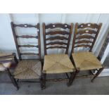 Two Arts and Crafts beech chairs (one a/f), a stool and a pair of elm rush seated ladderback chairs
