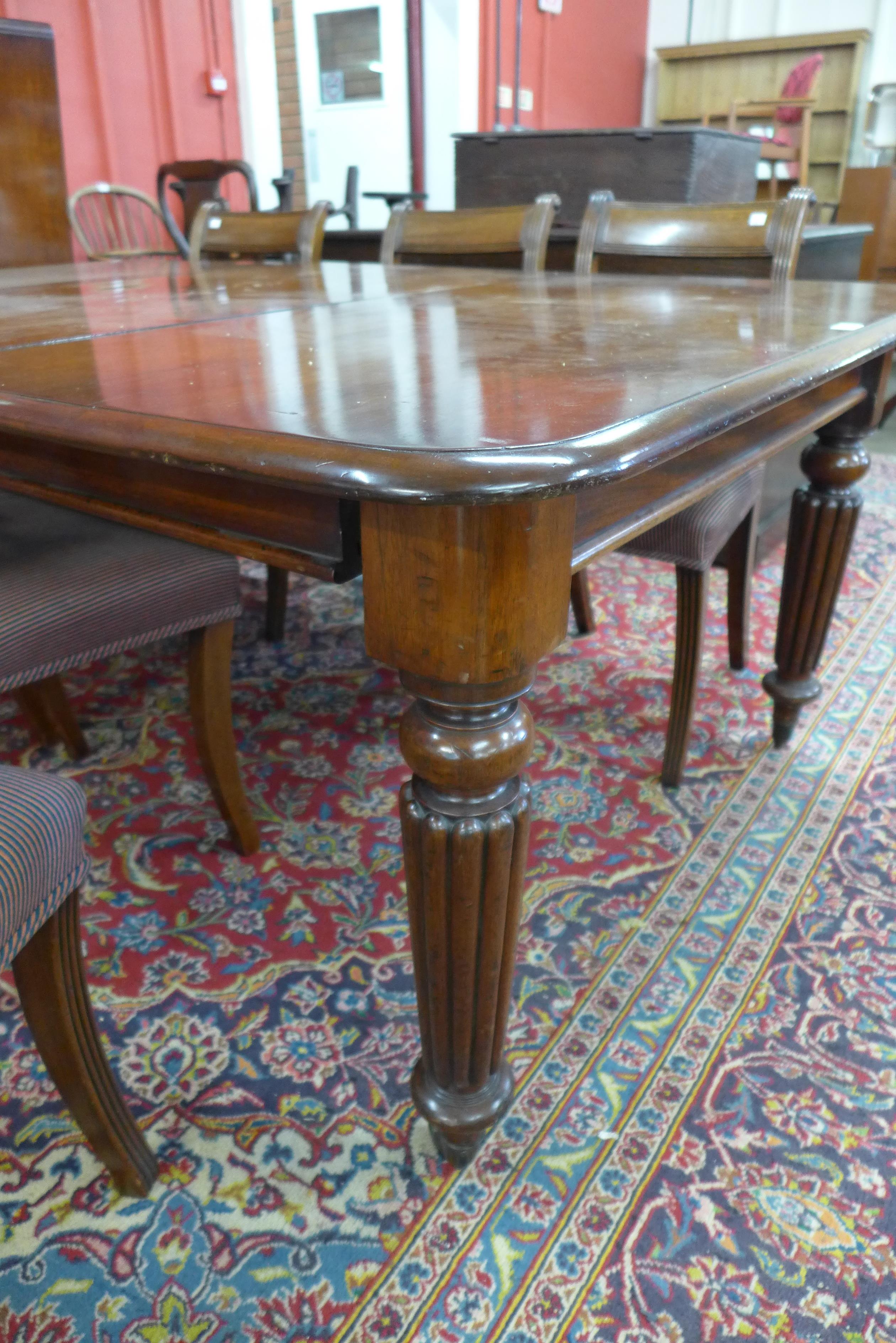 A Victorian mahogany extending dining table and six Regency style chairs, table dimensions; 72cms h, - Image 4 of 5