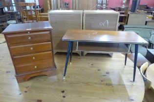 A small inlaid mahogany chest of drawers and a teak occasional table
