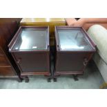 A pair of Chippendale style mahogany pot cupboards