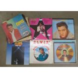 A collection of LP records, ten Elvis Presley and seven others