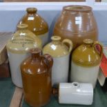 A collection of five salt glaze flagon, two a/f, a hot water bottle, and a keg