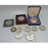 A collection of coins including 1951 crown and other crowns