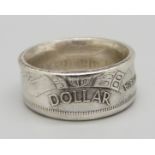 A ring made from a Canadian silver $1 coin, W