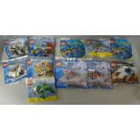 Eleven Lego packs including City, Creator, Atlantis and Racers, sealed